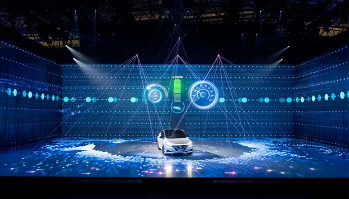 Car showcased on a floor LED display at an exhibition by Visual Lab, delivering immersive visual presentation and advanced interactive display technology.سيارة معروضة على شاشة إل إي دي أرضية في معرض من فيجوال لاب، تقدم تجربة عرض بصرية غامرة وتقنيات شاشات تفاعلية متقدمة.