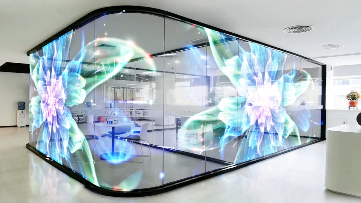 Transparent LED display in a glass-walled meeting room office by Visual Lab, delivering smart presentations and advanced interactive visual communication.Transparent LED display in a glass-walled meeting room office by Visual Lab, delivering smart presentations and advanced interactive visual communication.